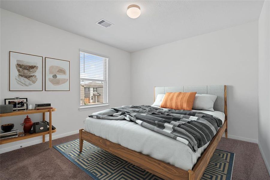 Secondary bedroom features plush carpet, neutral paint, lighting, large window with privacy blinds and ample sized closet space.