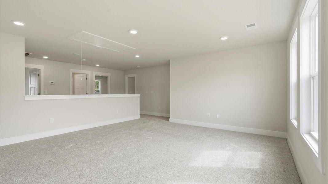 Memorable upstairs loft with plush carpeting and a bright, welcoming atmosphere