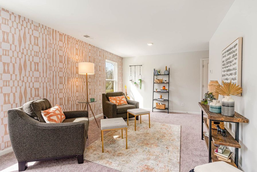 Representative furnished interior of a home built from the WREN by D.R. Horton in Kingston Bay, Conway (Image 29).