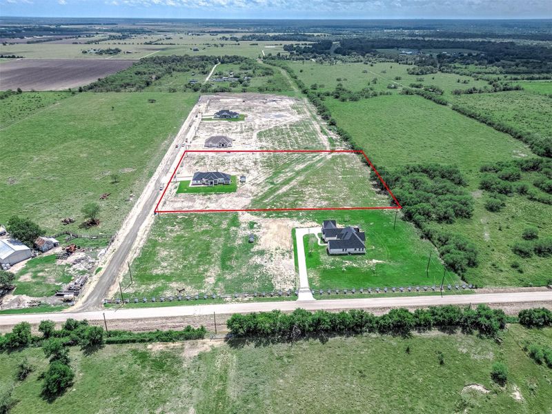 Aerial view of the subdivision, highlighting the property boundaries and its location within the community. Aerial view of the subdivision, highlighting the property boundaries and its location within the community.