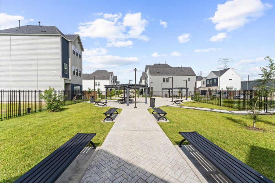 These pathways guide residents toward the heart of the neighborhood—a tranquil community courtyard.