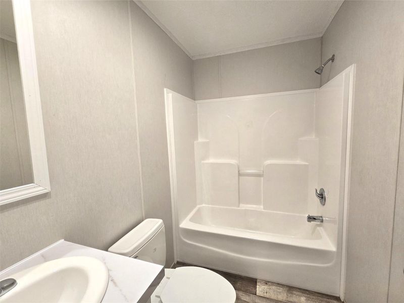 This inviting second bathroom offers a fresh, modern design with a sleek shower-tub combo, perfect for accommodating guests or family. This inviting second bathroom offers a fresh, modern design with a sleek shower-tub combo, perfect for accommodating guests or family.