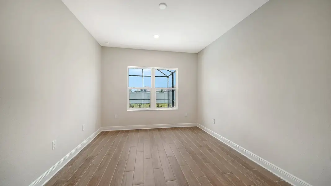 Spacious, unfurnished interior of a new home in Palm Grove Real Estate and Homes for Sale in Lakewood Ranch, FL - Neal Communities, Bradenton (Image 11).