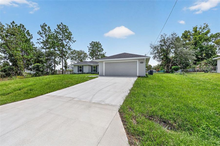 Front exterior of a new home in , Ocala, FL, highlighting curb appeal (Image 21).