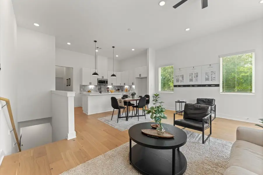 Expansive and light-filled open-concept layout seamlessly combining the living room, dining area, and kitchen on the second floor. The space boasts high ceilings, wide windows for abundant natural light, and elegant flooring that ties the zones together beautifully. The kitchen features modern cabinetry, sleek countertops, and a center island with bar seating—perfect for entertaining or casual meals. Expansive and light-filled open-concept layout seamlessly combining the living room, dining area, and kitchen on the second floor. The space boasts high ceilings, wide windows for abundant natural light, and elegant flooring that ties the zones together beautifully. The kitchen features modern cabinetry, sleek countertops, and a center island with bar seating—perfect for entertaining or casual meals.