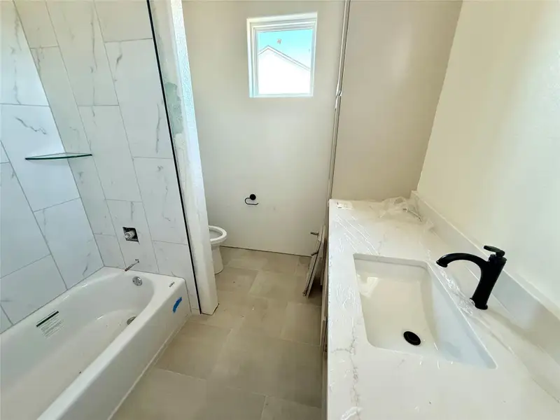 Full bathroom featuring vanity and bathtub / shower combination Full bathroom featuring vanity and bathtub / shower combination