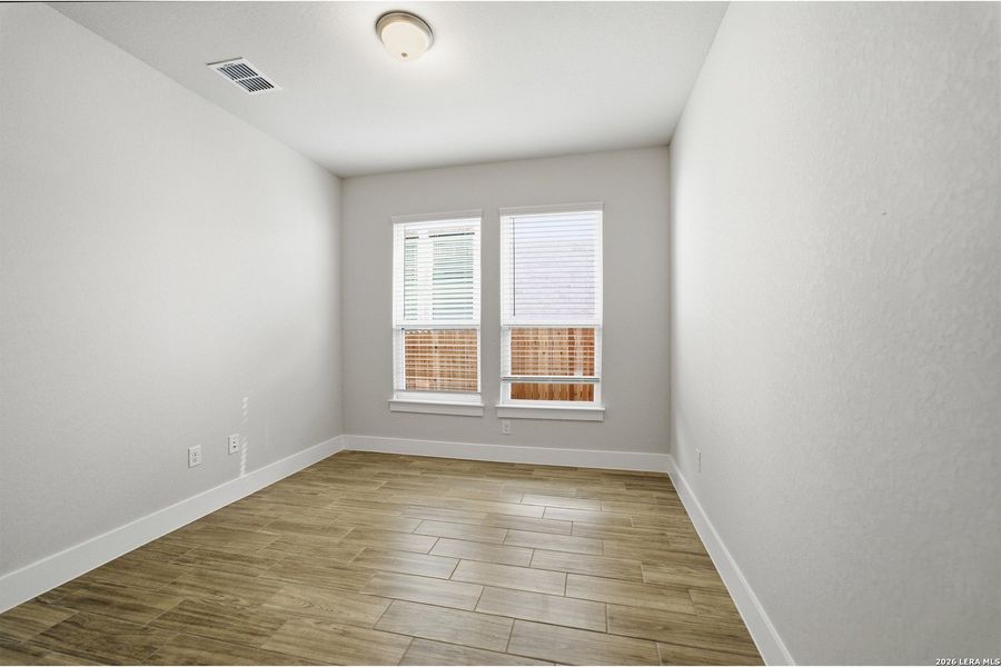 Spacious, unfurnished interior of a new home in The Woodlands at Medina Hills, Mico (Image 29).