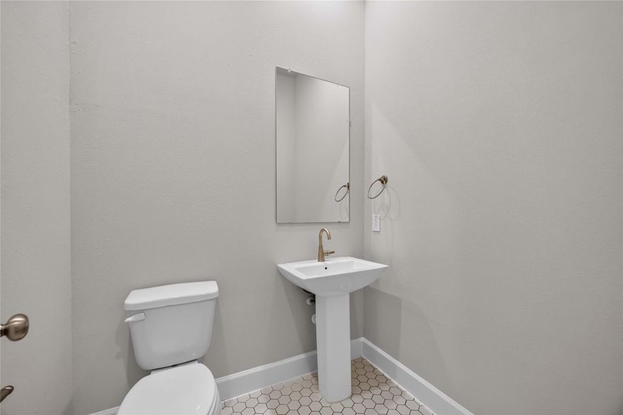 Elegant Powder Room – This half bath features sleek finishes offering both style and functionality for your guests.