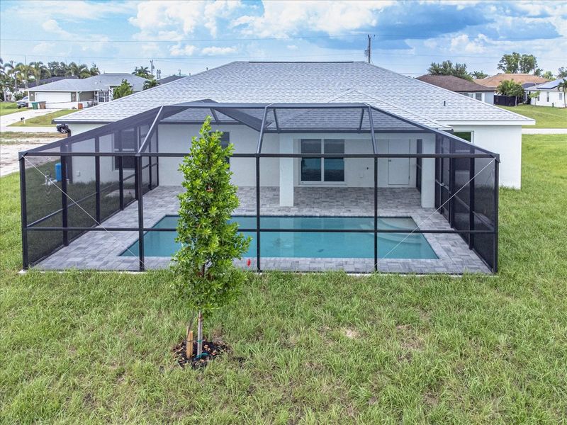 Representative exterior photo of a completed home built from the The Tidewater by Sunlife Homes LLC in Cape Coral, Cape Coral, FL (Image 17). Representative exterior photo of a completed home built from the The Tidewater by Sunlife Homes LLC in Cape Coral, Cape Coral, FL (Image 17).