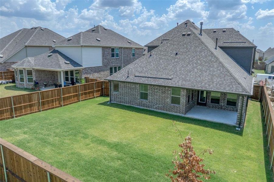 Exterior details and patio area of a home in Creekview Meadows, Pilot Point (Image 4).