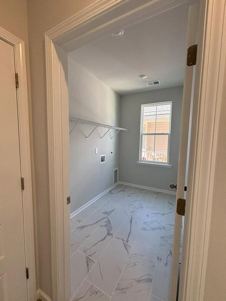 Spacious, unfurnished interior of a new home in Sweetgrass at Summers Corner: Row Collection, Summerville (Image 22).