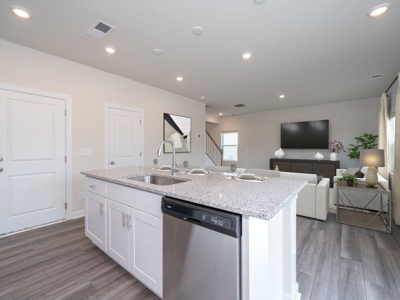 Turn the kitchen island into a bar counter seating area for guests.