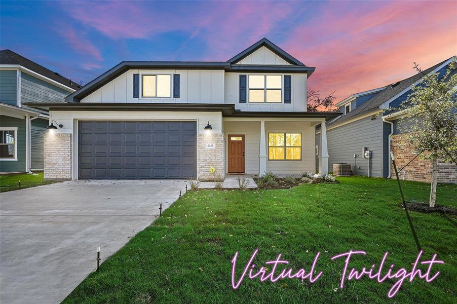 View of front of home with central air condition unit, a garage, and a lawn