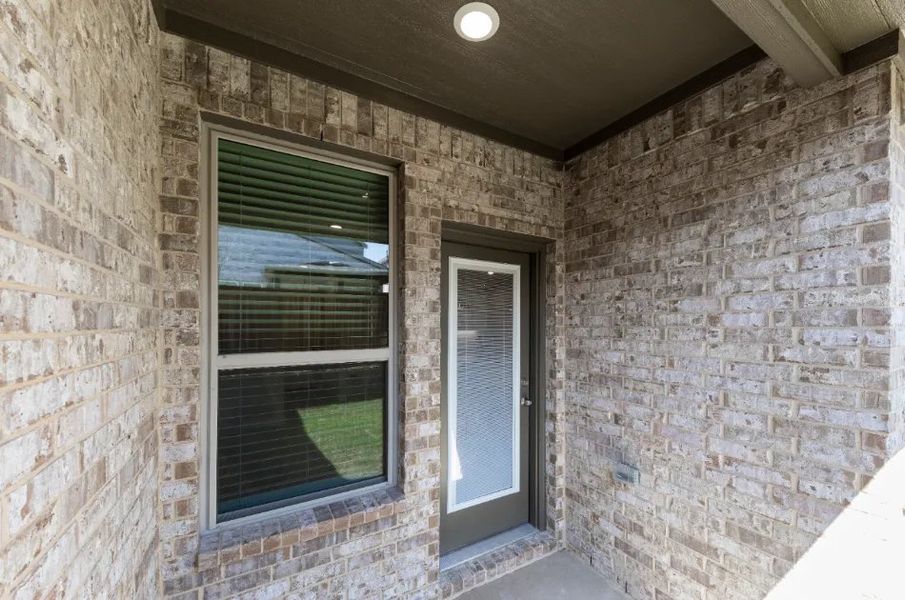 Front exterior of a new home in Sereno Oaks at Buckner Terrace, Dallas, TX, highlighting curb appeal (Image 20).