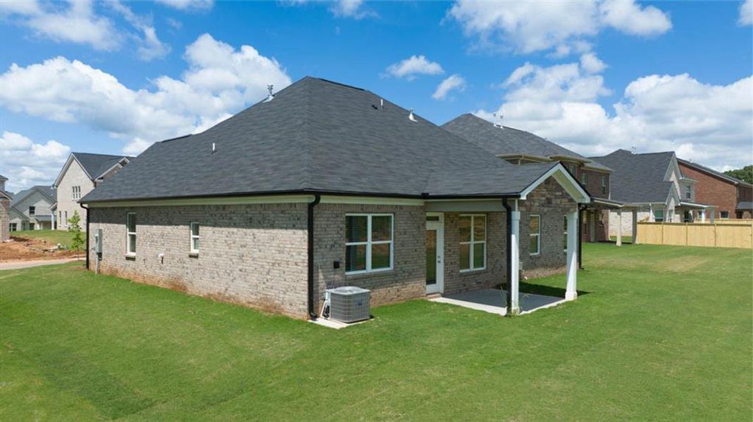 Exterior details and patio area of a home in Evergreen Crossing, Locust Grove (Image 3).
