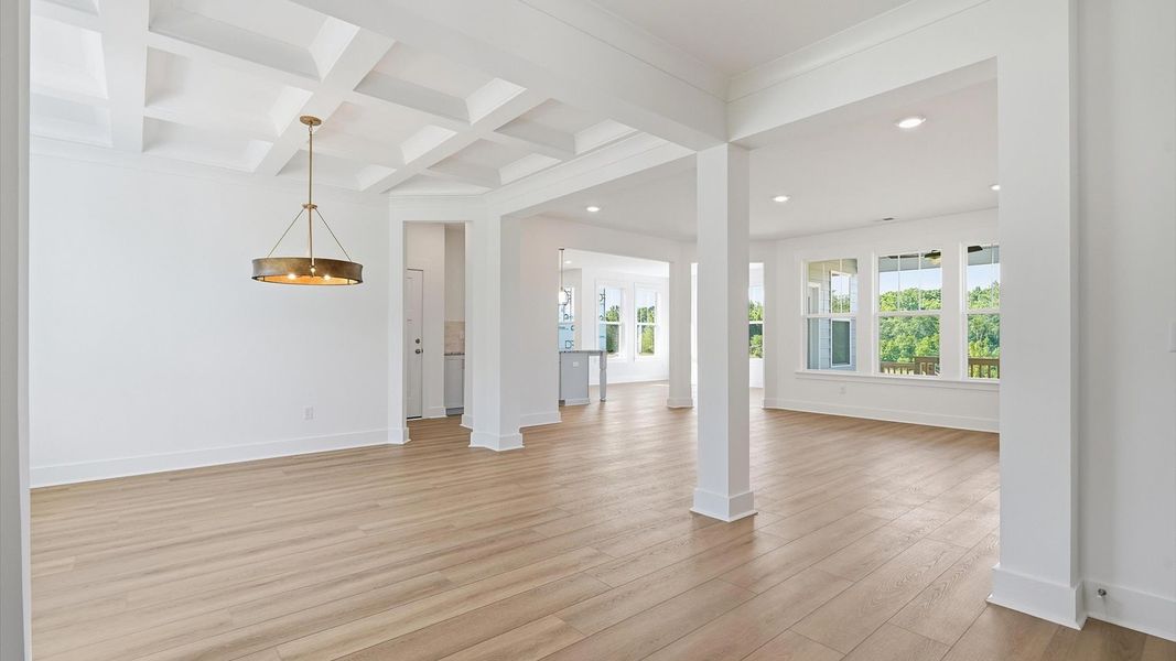 Accomplished hardwood flooring foyer sets the tone for tasteful design throughout the home located in Woodruff, SC