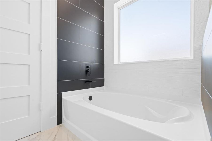 Soaking tub in master bathroom