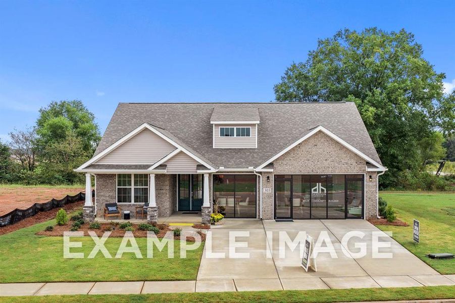 Craftsman-style house with a porch and a front lawn