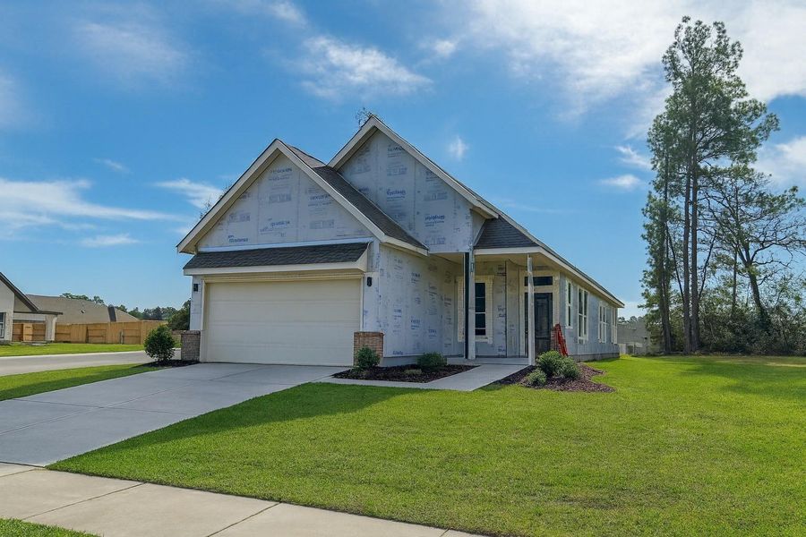 Front exterior of a new home in Evergreen, Conroe, TX, highlighting curb appeal (Image 7).