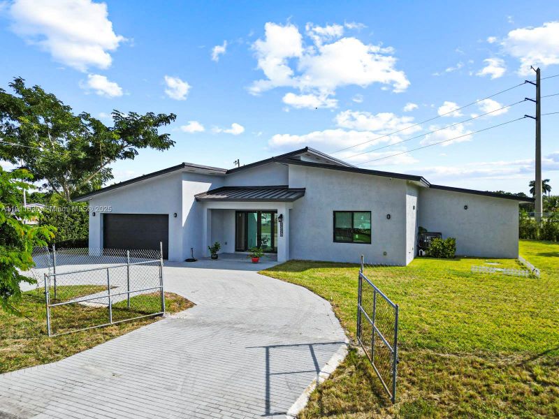 Front exterior of a new home in , Goulds, FL, highlighting curb appeal (Image 21). Front exterior of a new home in , Goulds, FL, highlighting curb appeal (Image 21).