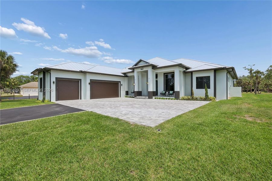 Front exterior of a new home in , Naples, FL, highlighting curb appeal (Image 21).