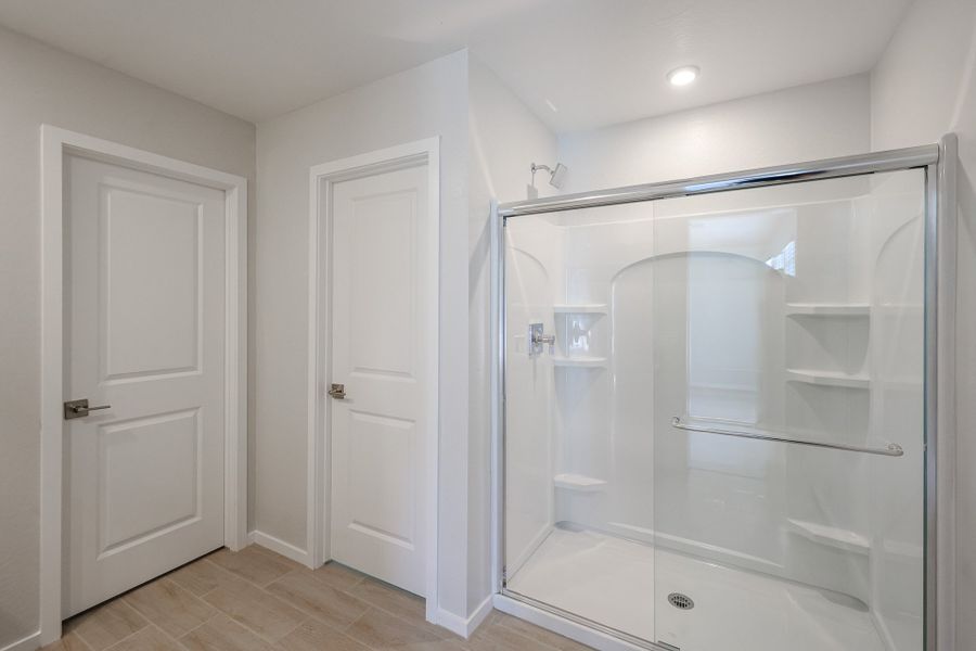 A bathroom with a glass shower.