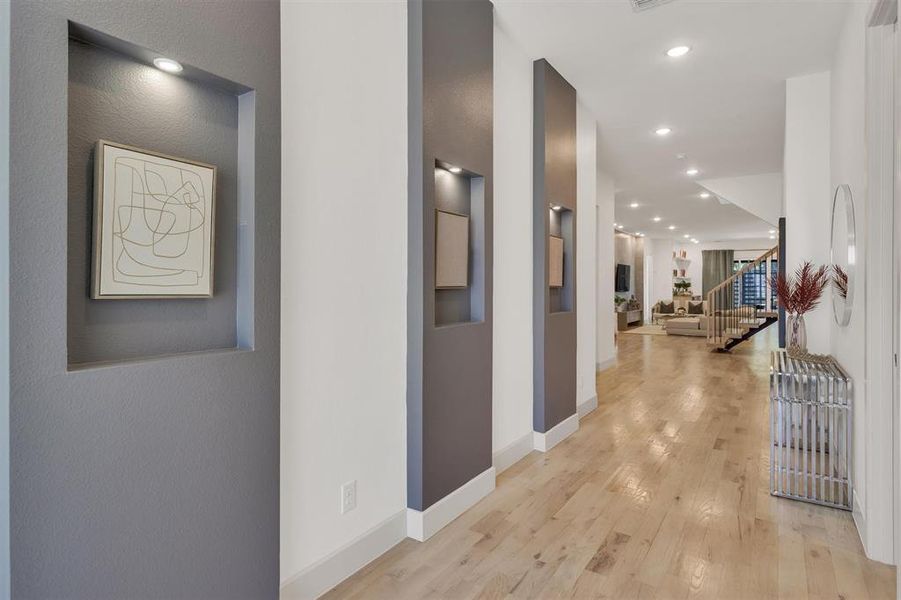 Hallway with light hardwood / wood-style floors