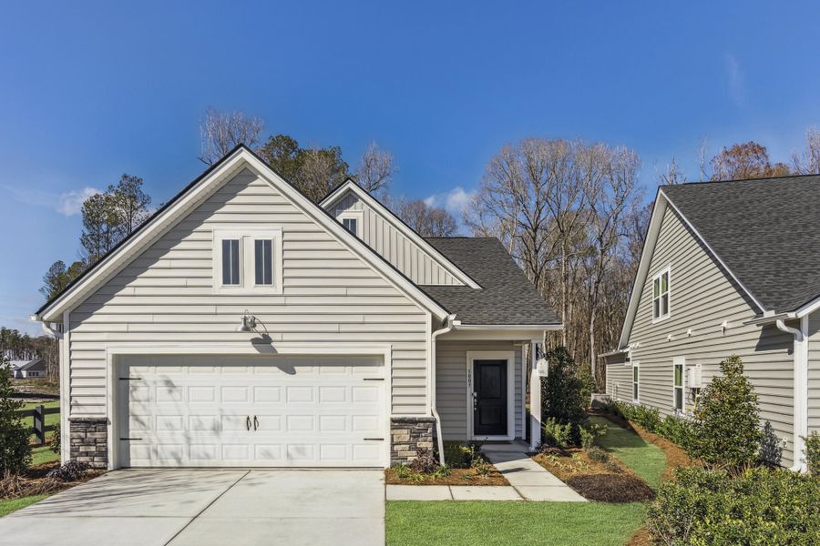 Front exterior of a new home in Horizons at Summers Corner | 55+, Summerville, SC, highlighting curb appeal (Image 24).