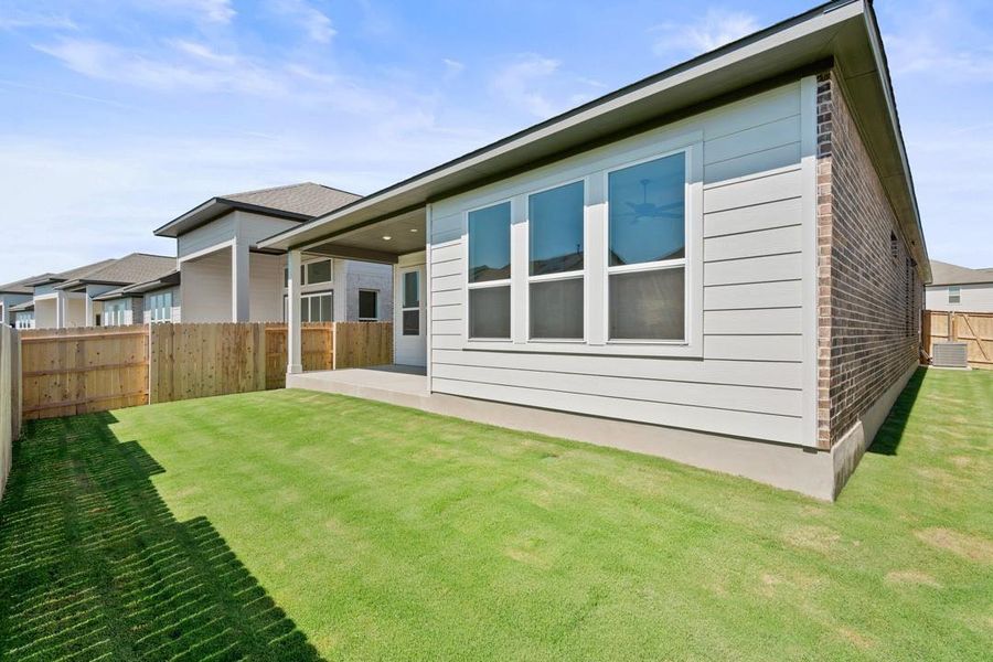 Front exterior of a new home in Arbor Collection at Lariat, Liberty Hill, TX, highlighting curb appeal (Image 19). Front exterior of a new home in Arbor Collection at Lariat, Liberty Hill, TX, highlighting curb appeal (Image 19).