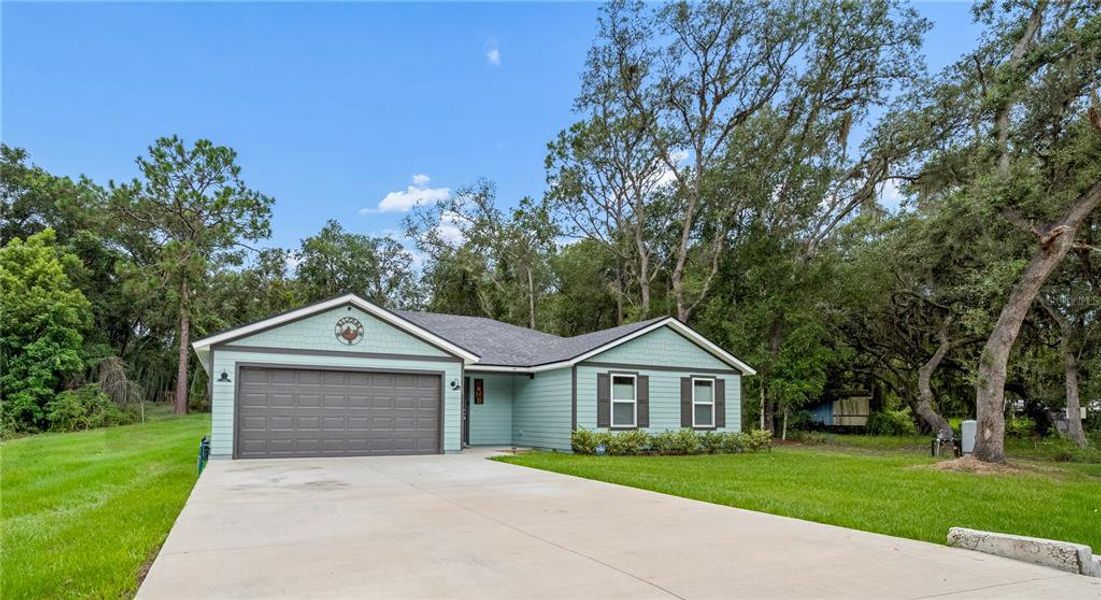 Front exterior of a new home in , Satsuma, FL, highlighting curb appeal (Image 1). Front exterior of a new home in , Satsuma, FL, highlighting curb appeal (Image 1).