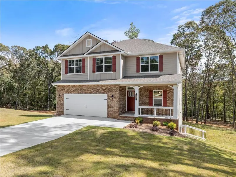Front exterior of a new home in The Fields of Walnut Creek, Pendergrass, GA, highlighting curb appeal (Image 1).