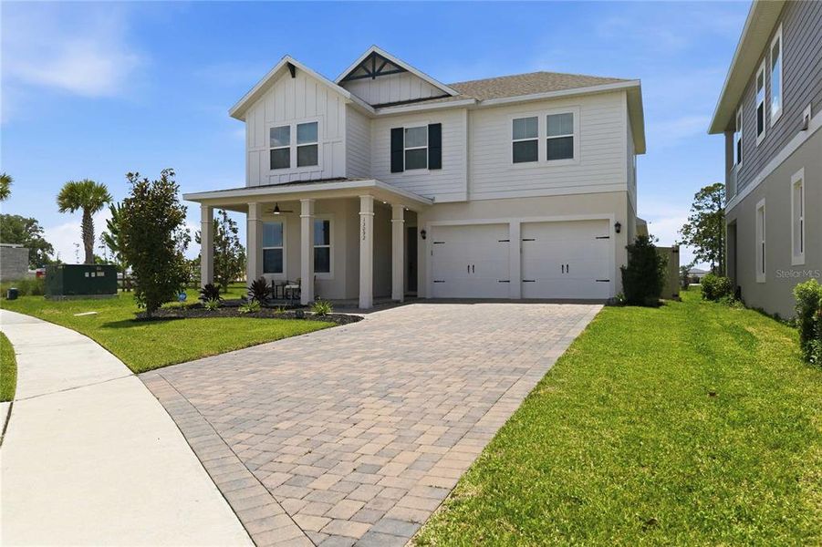 Front exterior of a new home in , Winter Garden, FL, highlighting curb appeal (Image 2). Front exterior of a new home in , Winter Garden, FL, highlighting curb appeal (Image 2).
