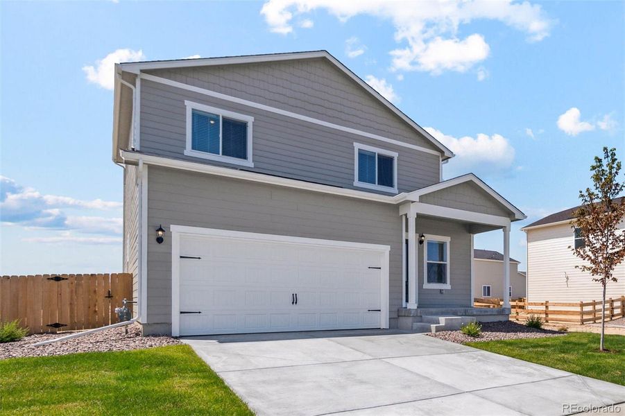 Front exterior of a new home in , Frederick, CO, highlighting curb appeal (Image 14).