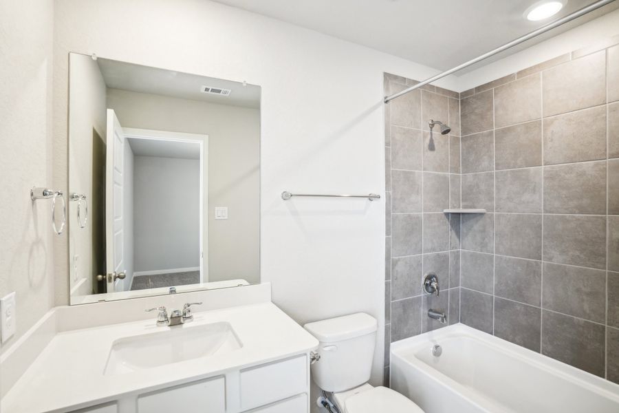 Guest bathroom of the Reynolds floorplan at a Meritage Homes community.