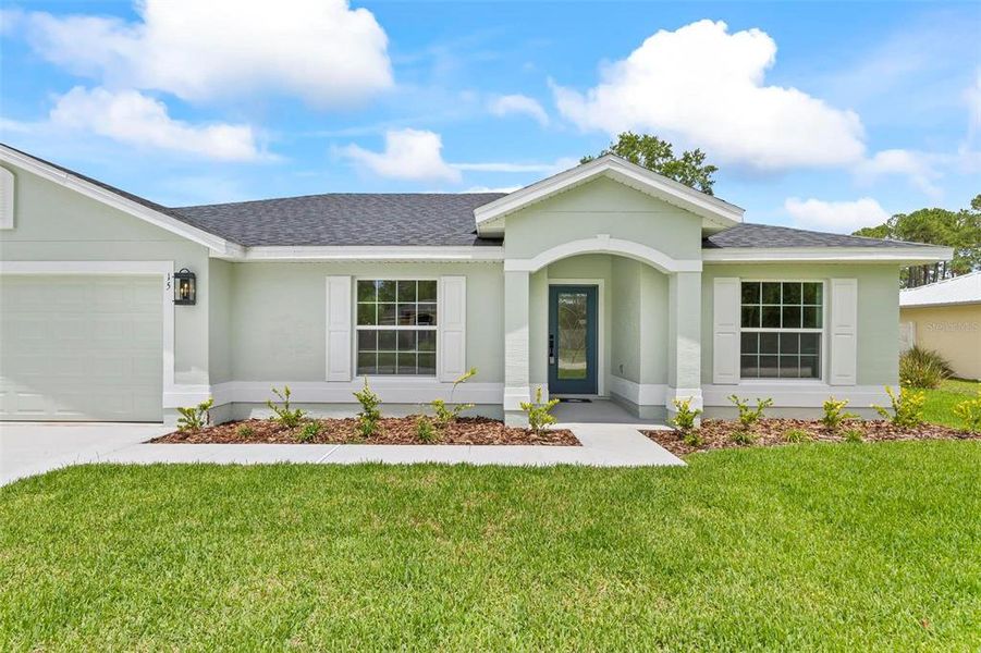 Front exterior of a new home in , Palm Coast, FL, highlighting curb appeal (Image 24).