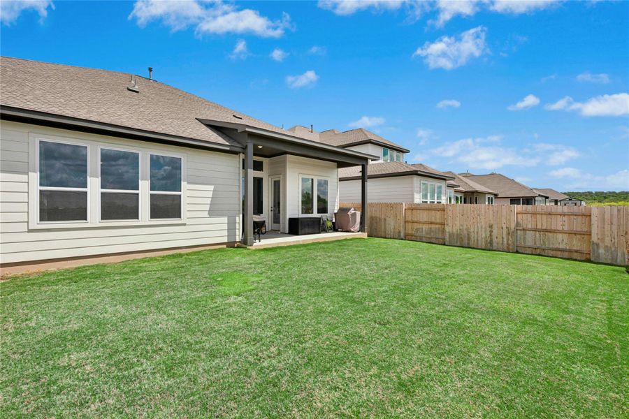 Back of property with a patio area, a fenced backyard and room for pool.