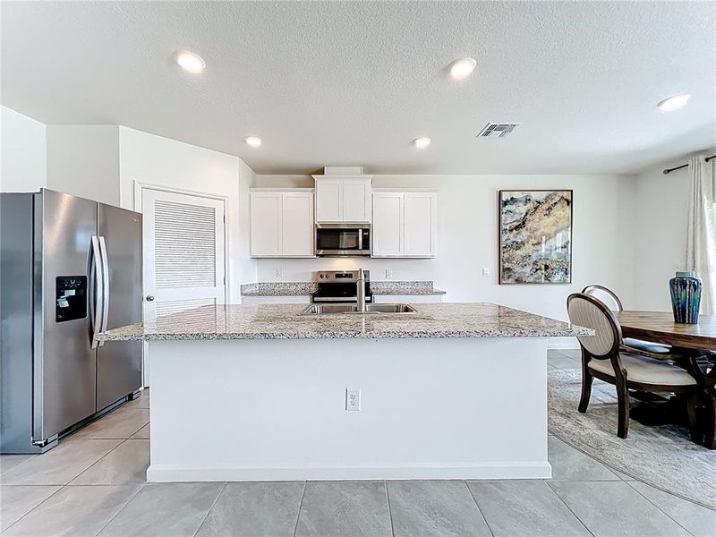 Furnished interior view inside a new home in Cypress Bay West, Palm Bay (Image 6).