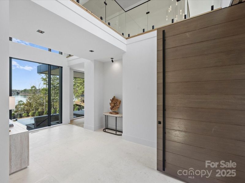 Two story foyer with limestone flooring