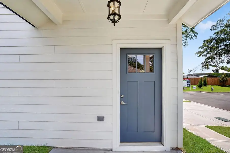 Exterior details and patio area of a home in The Cottages at East Lanier, Fayetteville (Image 4).