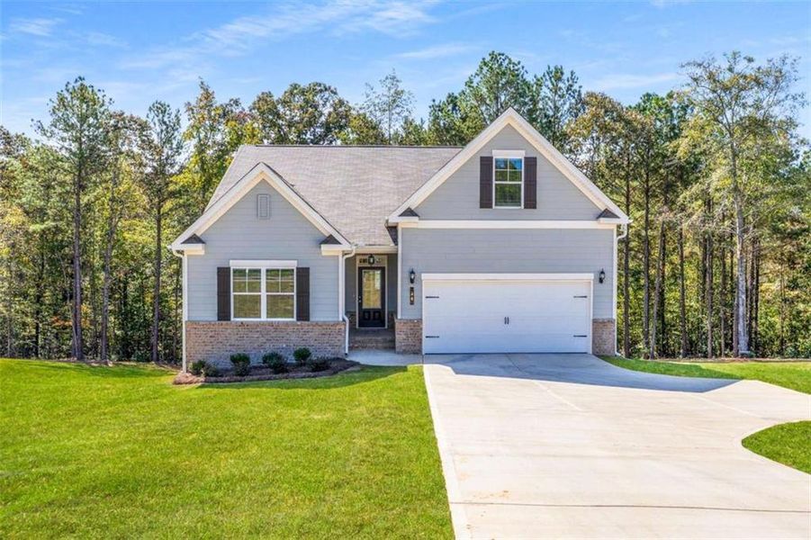 Front exterior of a new home in Waters Edge, Mansfield, GA, highlighting curb appeal (Image 2). Front exterior of a new home in Waters Edge, Mansfield, GA, highlighting curb appeal (Image 2).