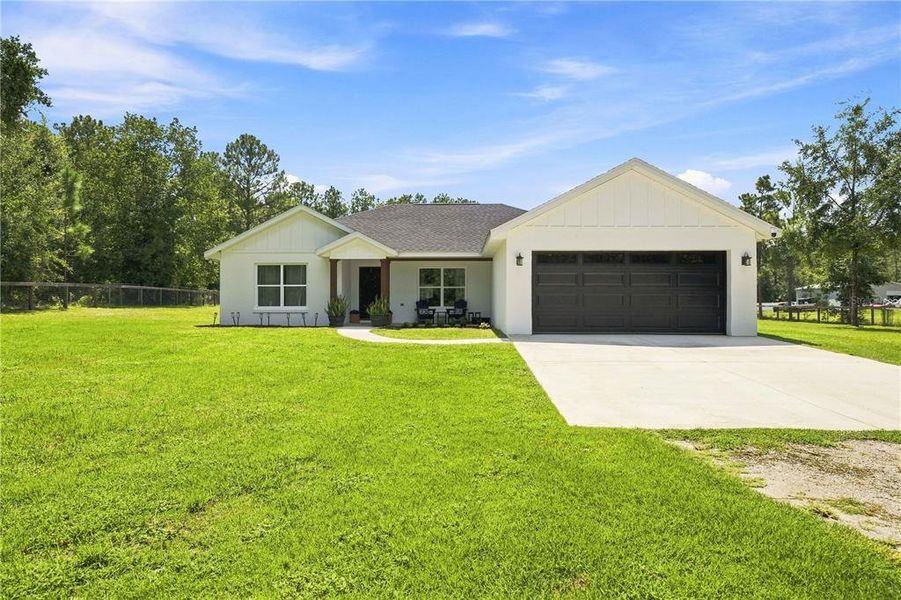 Front exterior of a new home in , Ocala, FL, highlighting curb appeal (Image 2). Front exterior of a new home in , Ocala, FL, highlighting curb appeal (Image 2).