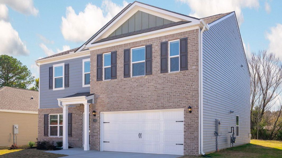 Front exterior of a new home in Hillcrest Landing, McDonald, TN, highlighting curb appeal (Image 2).