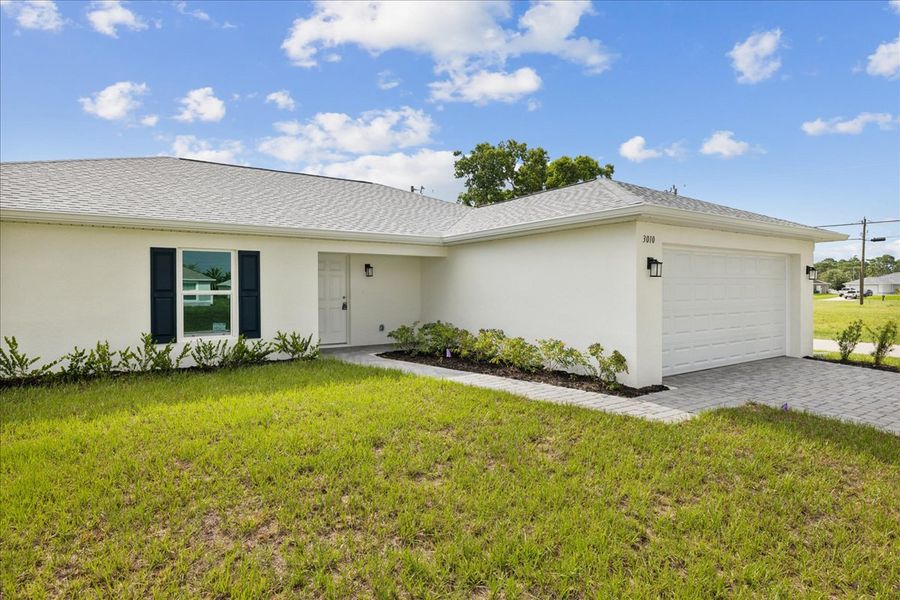 Representative exterior photo of a completed home built from the The Sunshine Retreat by Sunlife Homes LLC in Cape Coral, Cape Coral, FL (Image 1).