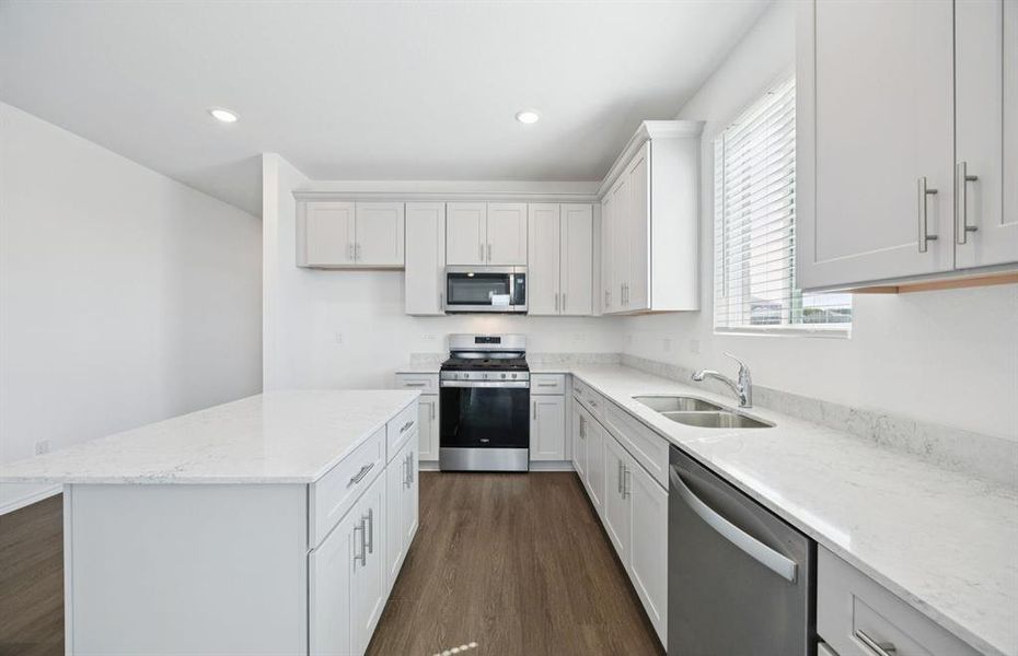 Spacious kitchen with eat-in bartop island Spacious kitchen with eat-in bartop island