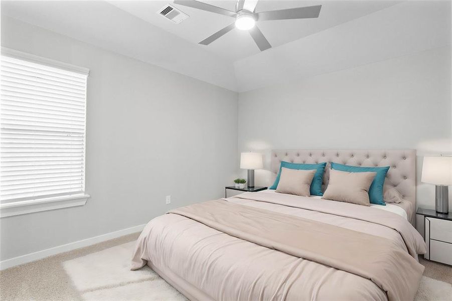 Secondary bedroom features plush carpet, custom paint, high ceilings with ceiling fan, large window with privacy blinds and access to the Jack and Jill bath.