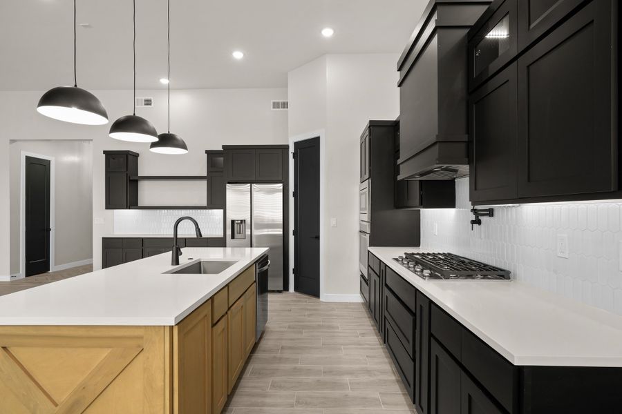 Representative furnished interior of a home built from the Pebble Beach- II by LEH. Homes in Verdancia, El Paso (Image 16).