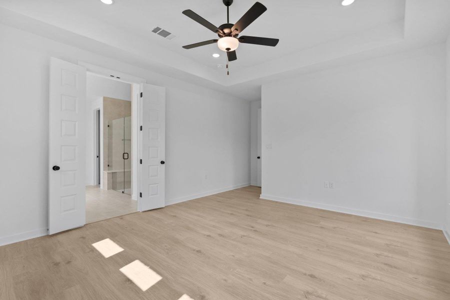 Primary Bedroom with tray ceiling Primary Bedroom with tray ceiling