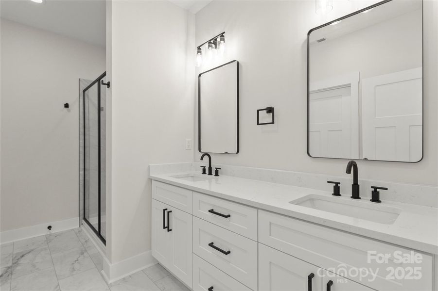 Primary bath with two vanities. All soft close drawers and cabinets