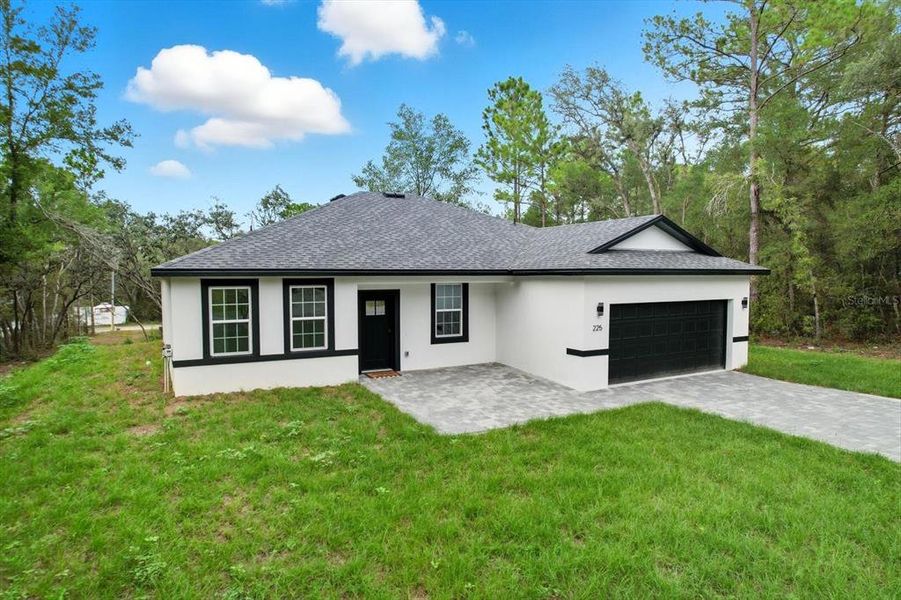 Front exterior of a new home in , Citrus Springs, FL, highlighting curb appeal (Image 22).