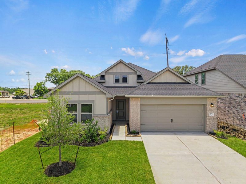 Front exterior of a new home in Laurel Landing, Alvin, TX, highlighting curb appeal (Image 2). Front exterior of a new home in Laurel Landing, Alvin, TX, highlighting curb appeal (Image 2).